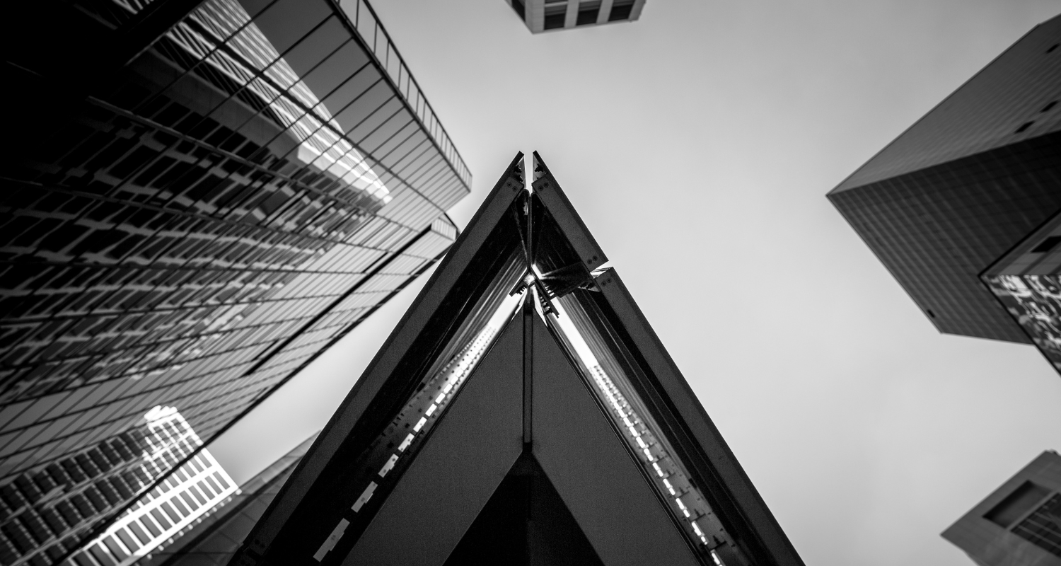The image is a black and white photo of the top of skyscrapers as you look from below. This is not an example of How Can Architecture Change The World